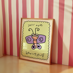 a picture frame with a picture of a butterfly on it