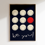 a black and white picture with a red smiley face