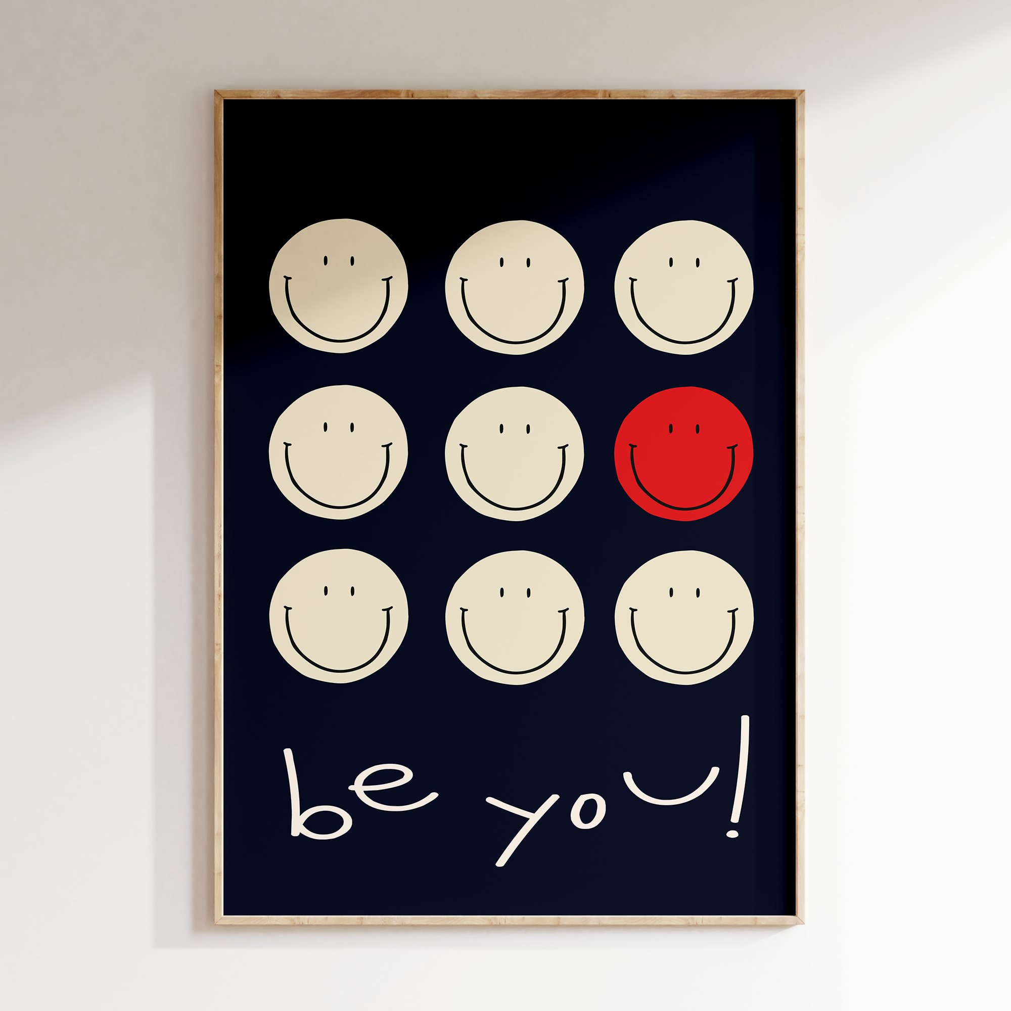 a black and white picture with a red smiley face