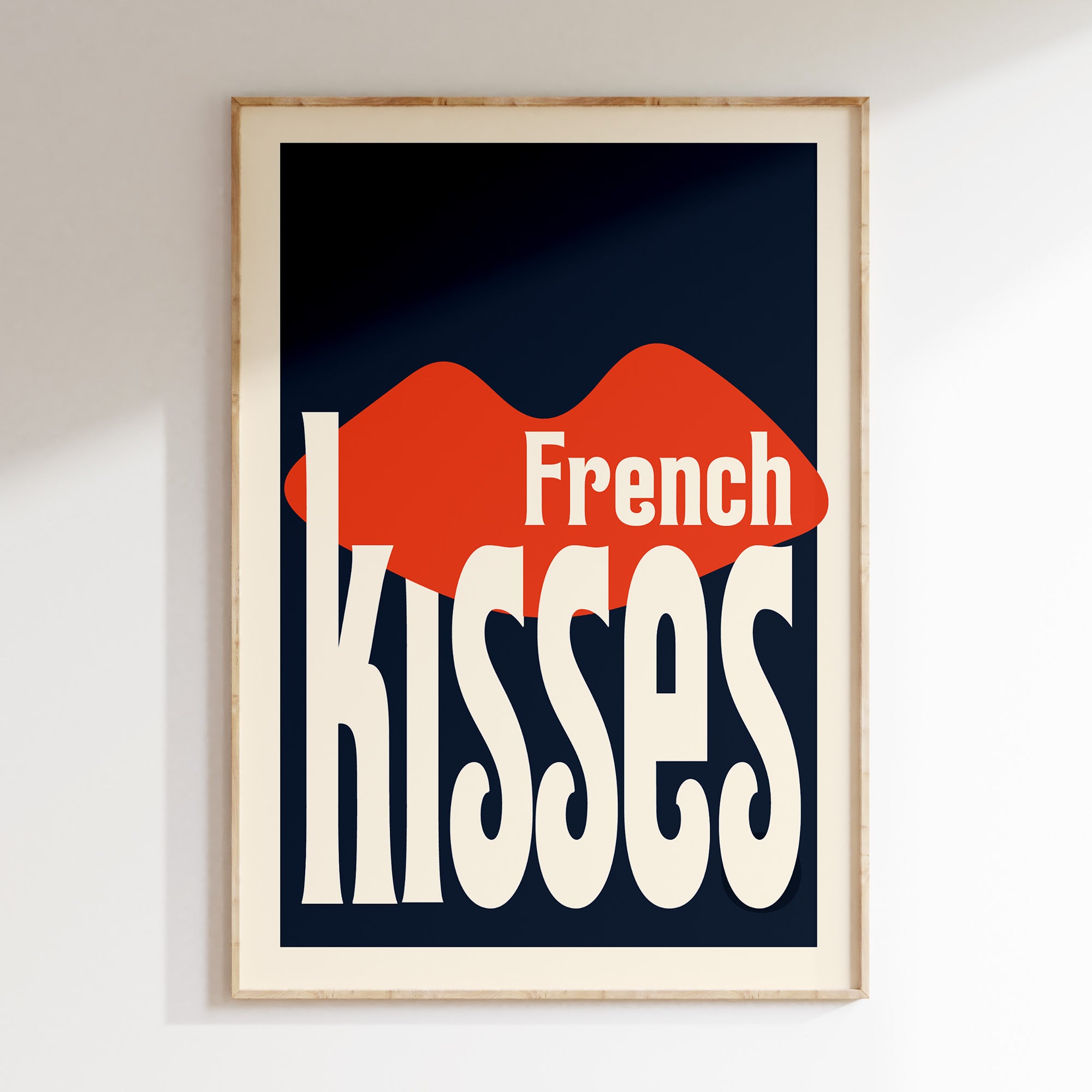 French Kisses retro print in oak frame, red lips with cream warped lettering on navy