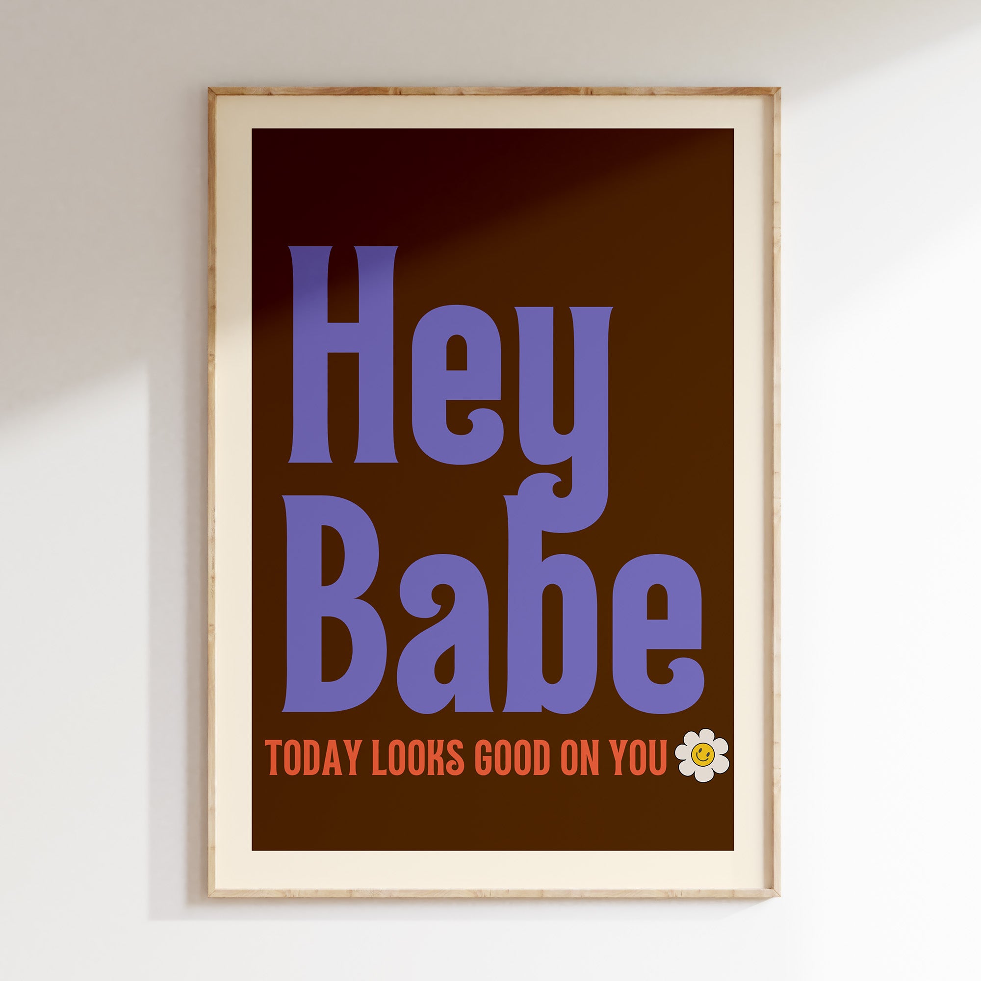 Hey Babe retro print in oak frame, purple retro lettering with daisy on chocolate brown