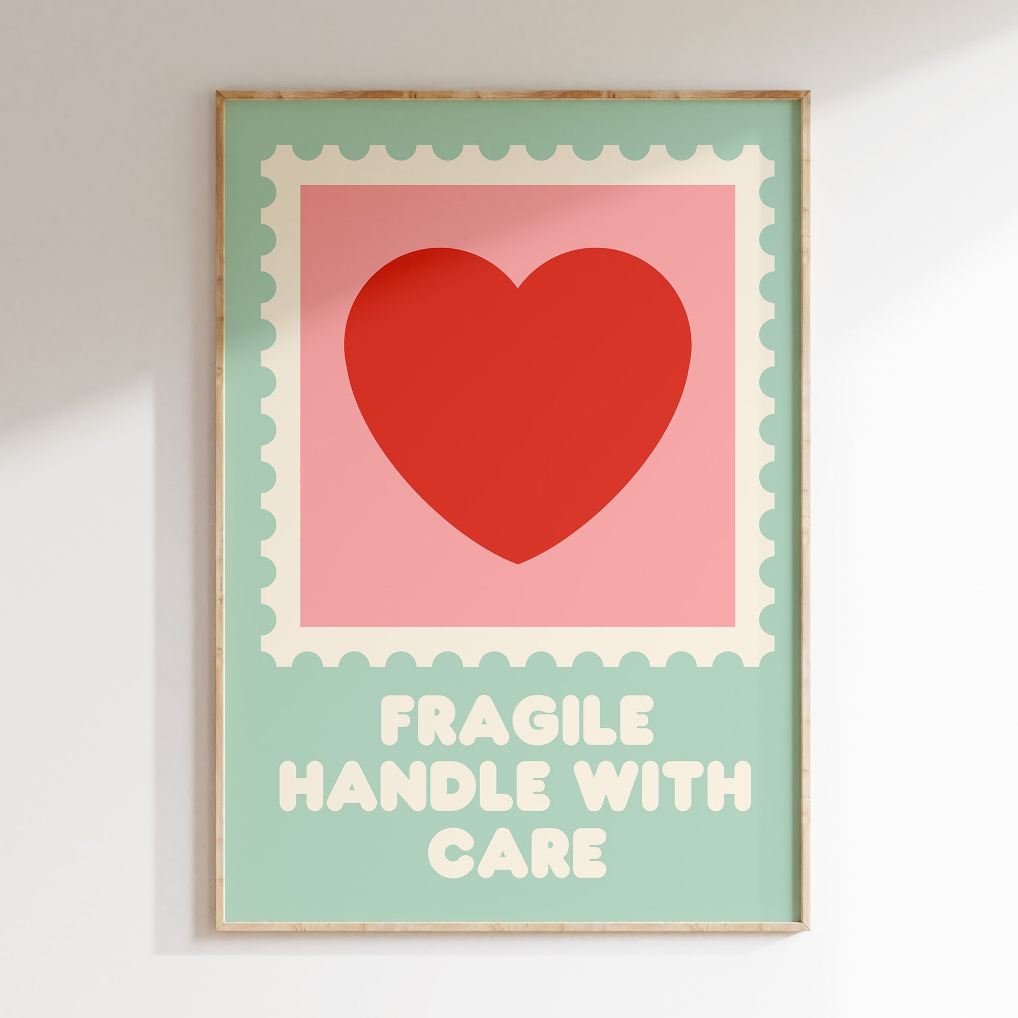 Fragile Handle With Care retro print in oak frame, postage stamp frame with red heart on pink and green