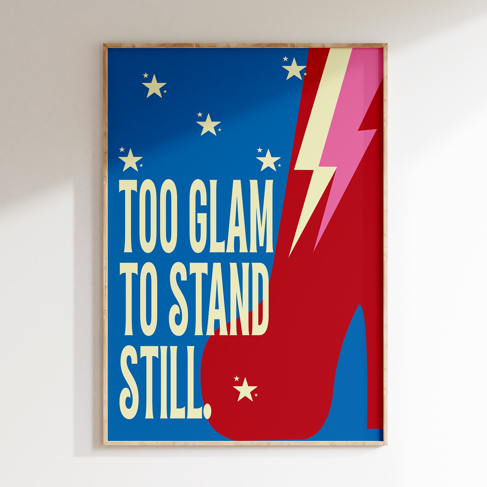 Too Glam retro print in oak frame, red platform boot with lightning bolt on blue