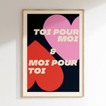 Toi Pour Moi & Moi Pour Toi retro print in oak frame, pink and red hearts with cream lettering on navy