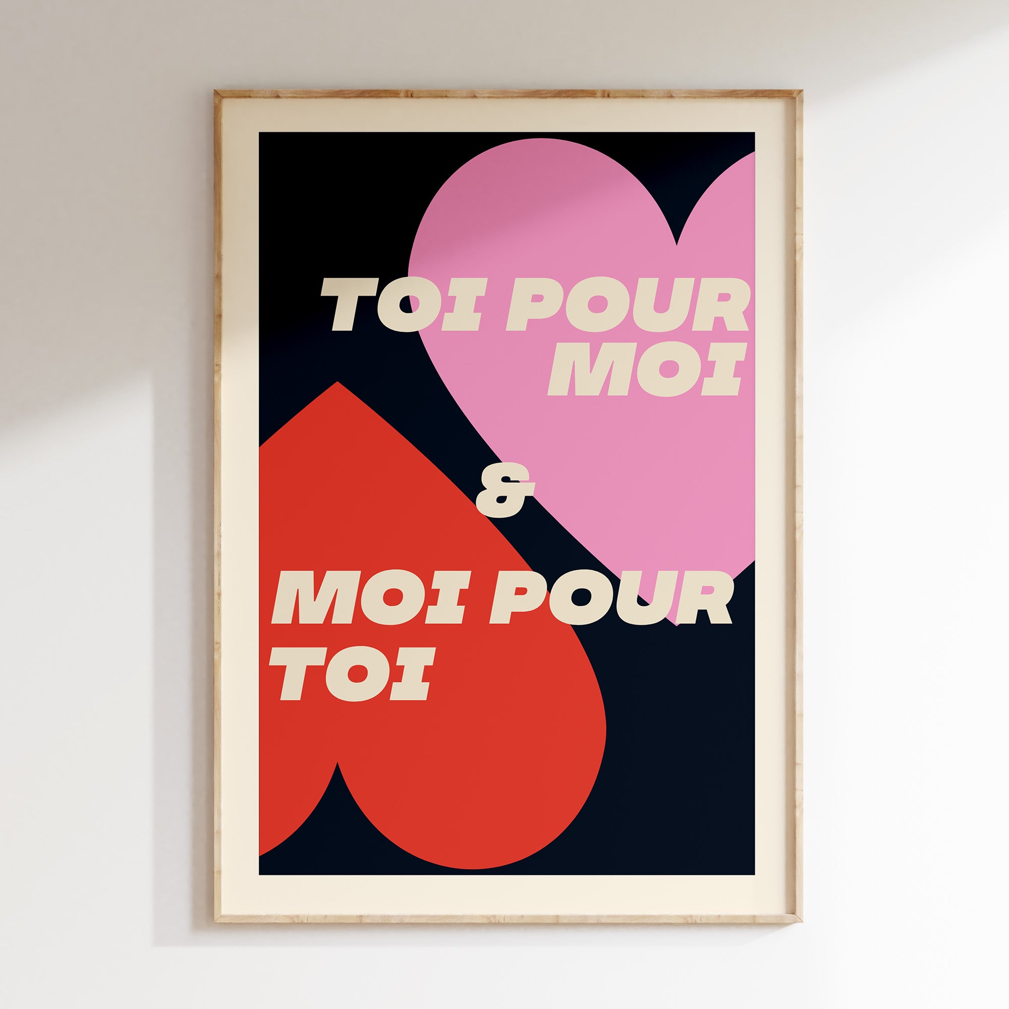 Toi Pour Moi & Moi Pour Toi retro print in oak frame, pink and red hearts with cream lettering on navy