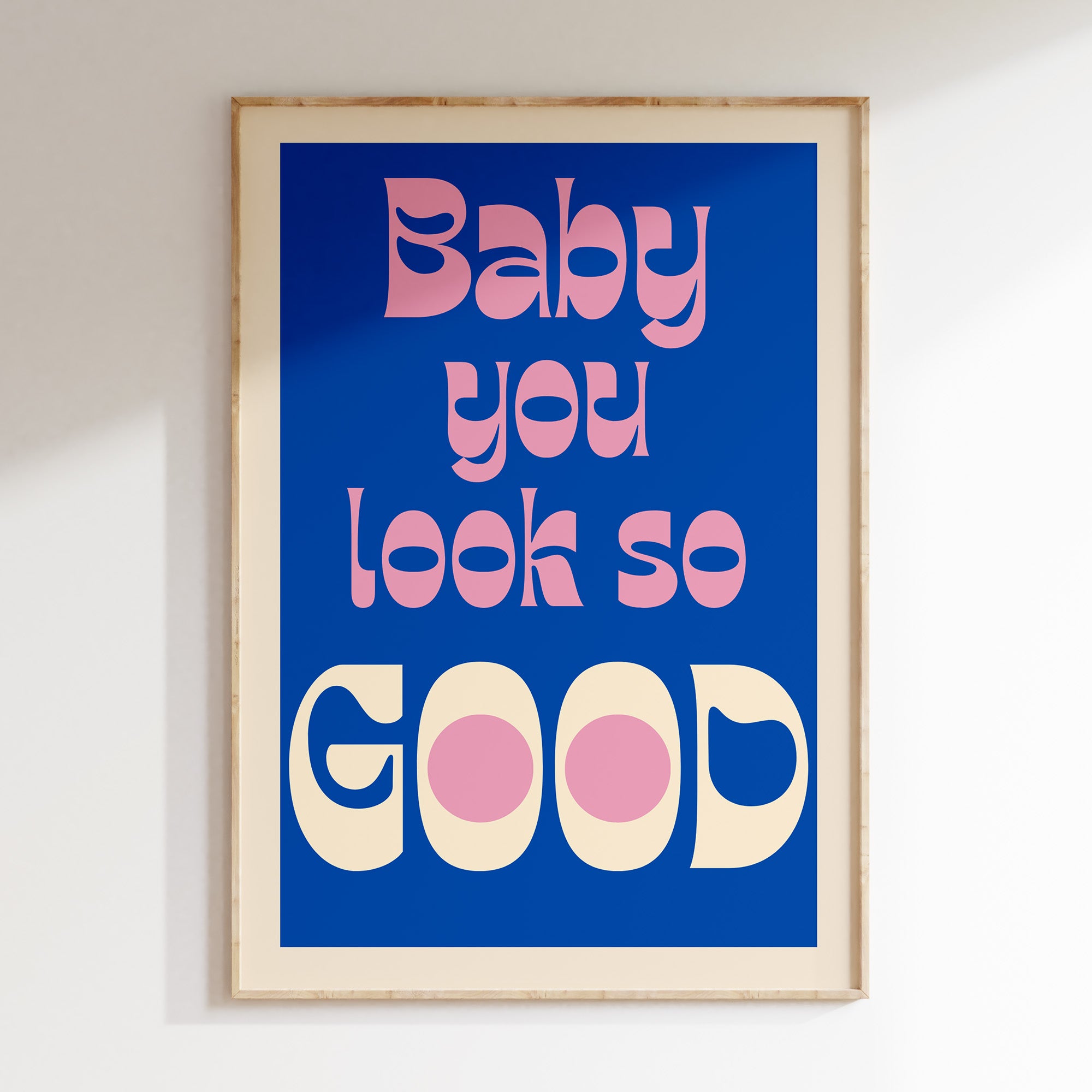 Baby You Look So Good retro print in oak frame, pink and cream bubble lettering on cobalt