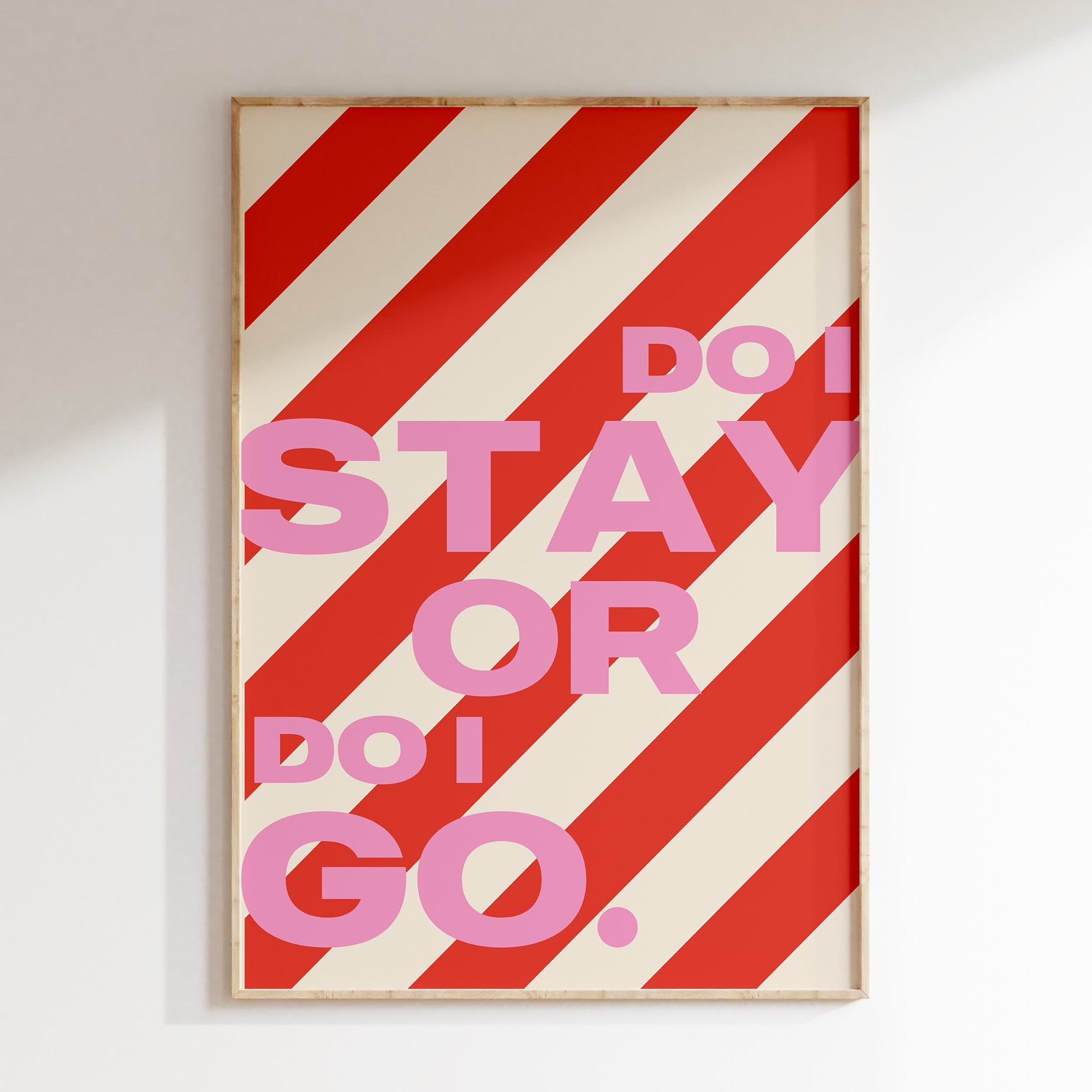 Do I Stay or Do I Go retro print in oak frame, bold pink lettering on candy  red stripes
