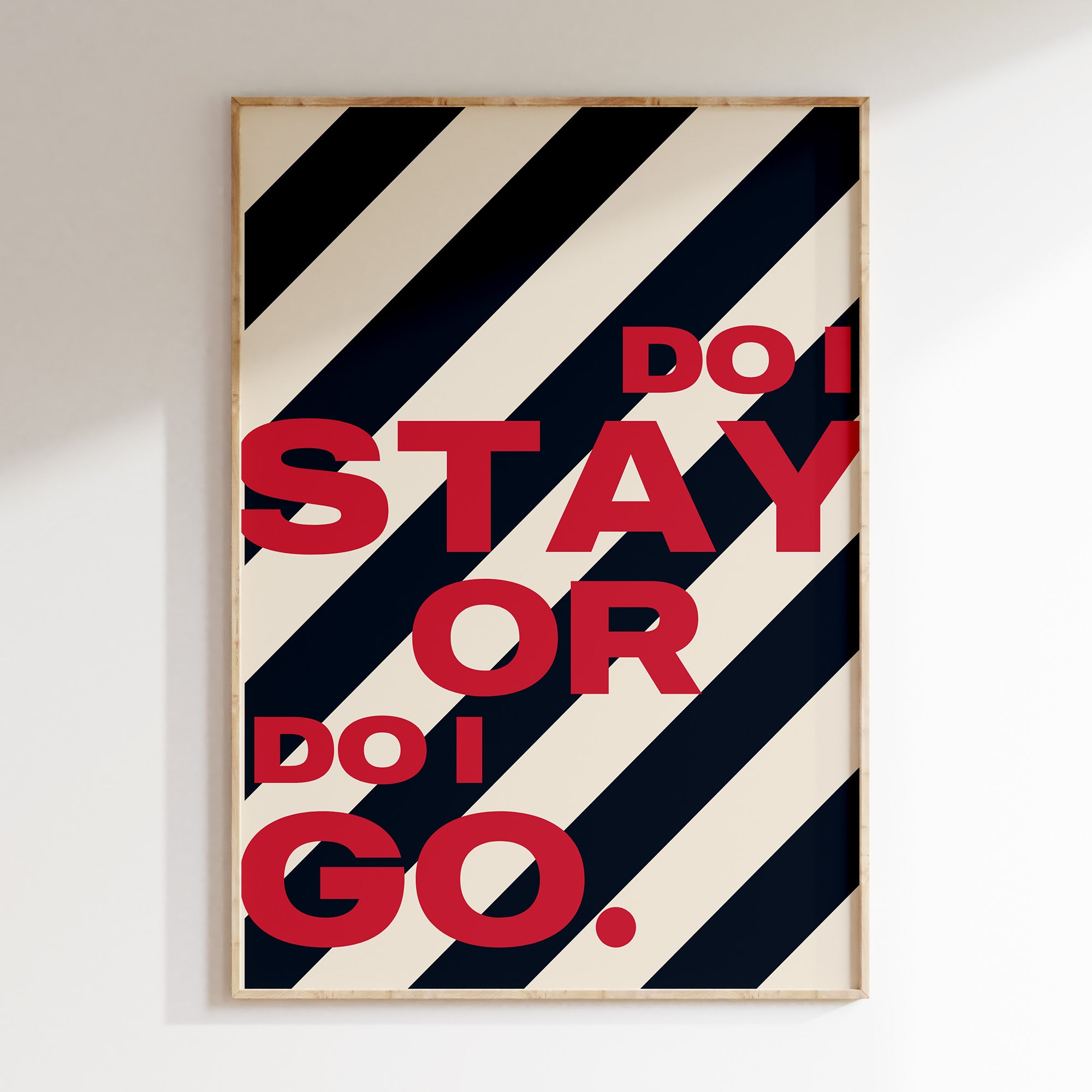 Do I Stay or Do I Go retro print in oak frame, bold red lettering on black stripes