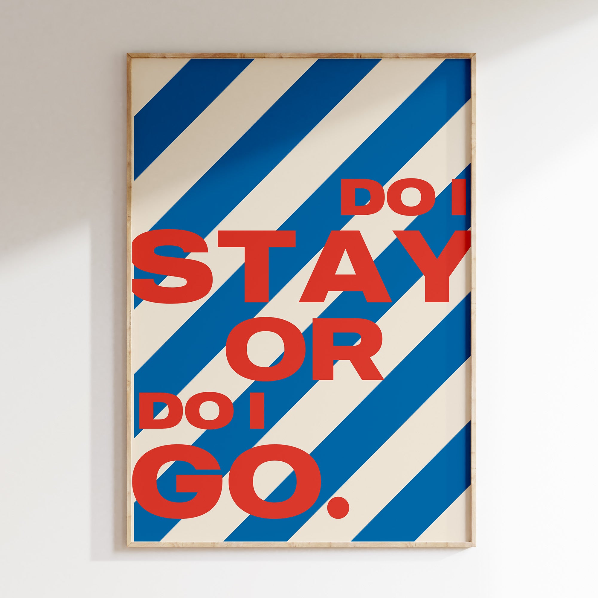 Do I Stay or Do I Go retro print in oak frame, bold red lettering on candy blue stripes