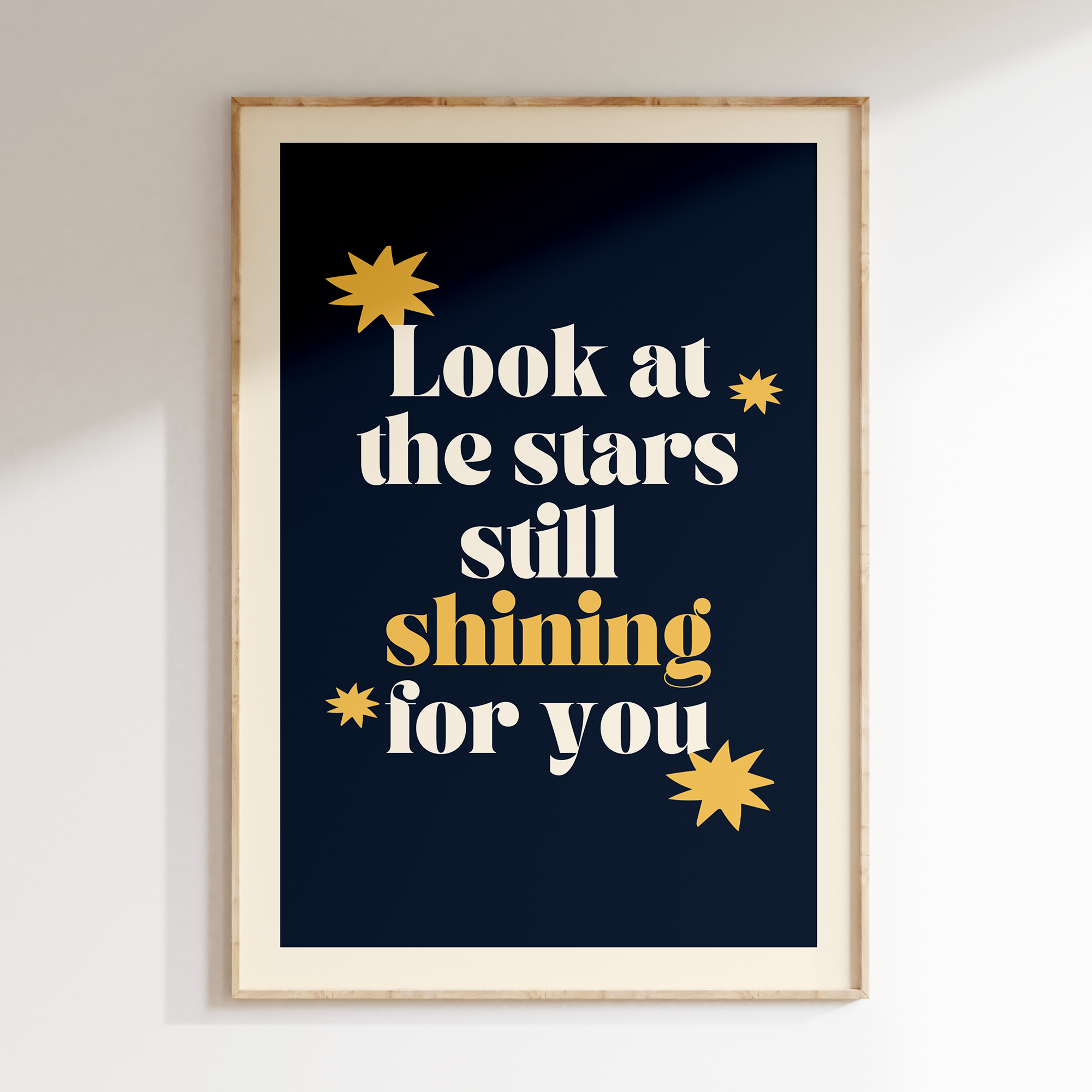 Look At The Stars retro print in oak frame, cream serif lettering with gold stars on navy