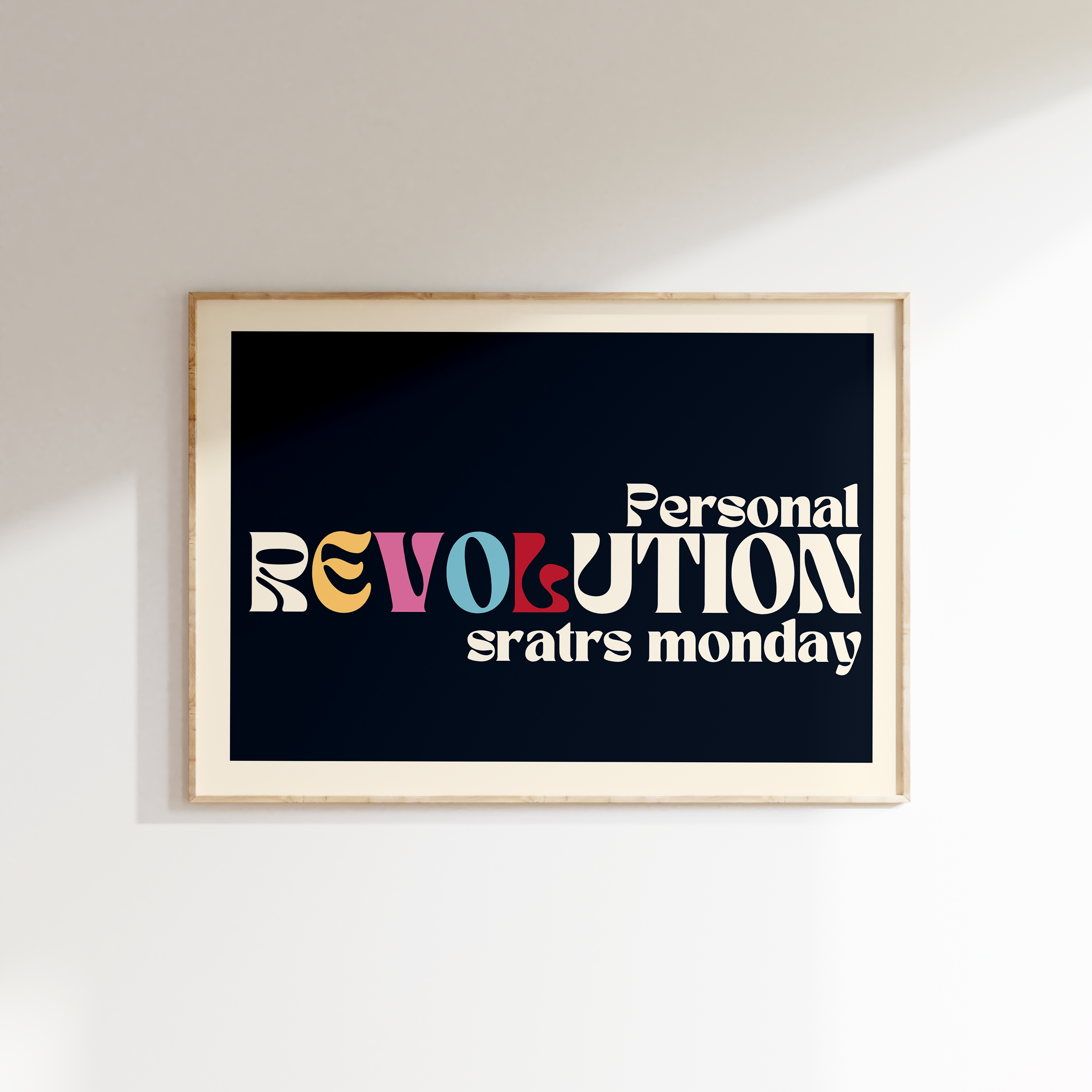 Personal Revolution Starts Monday retro print in oak frame, multicoloured stacked REVOLUTION lettering on navy