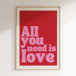 All You Need Is Love retro print in oak frame, red background with pink retro lettering