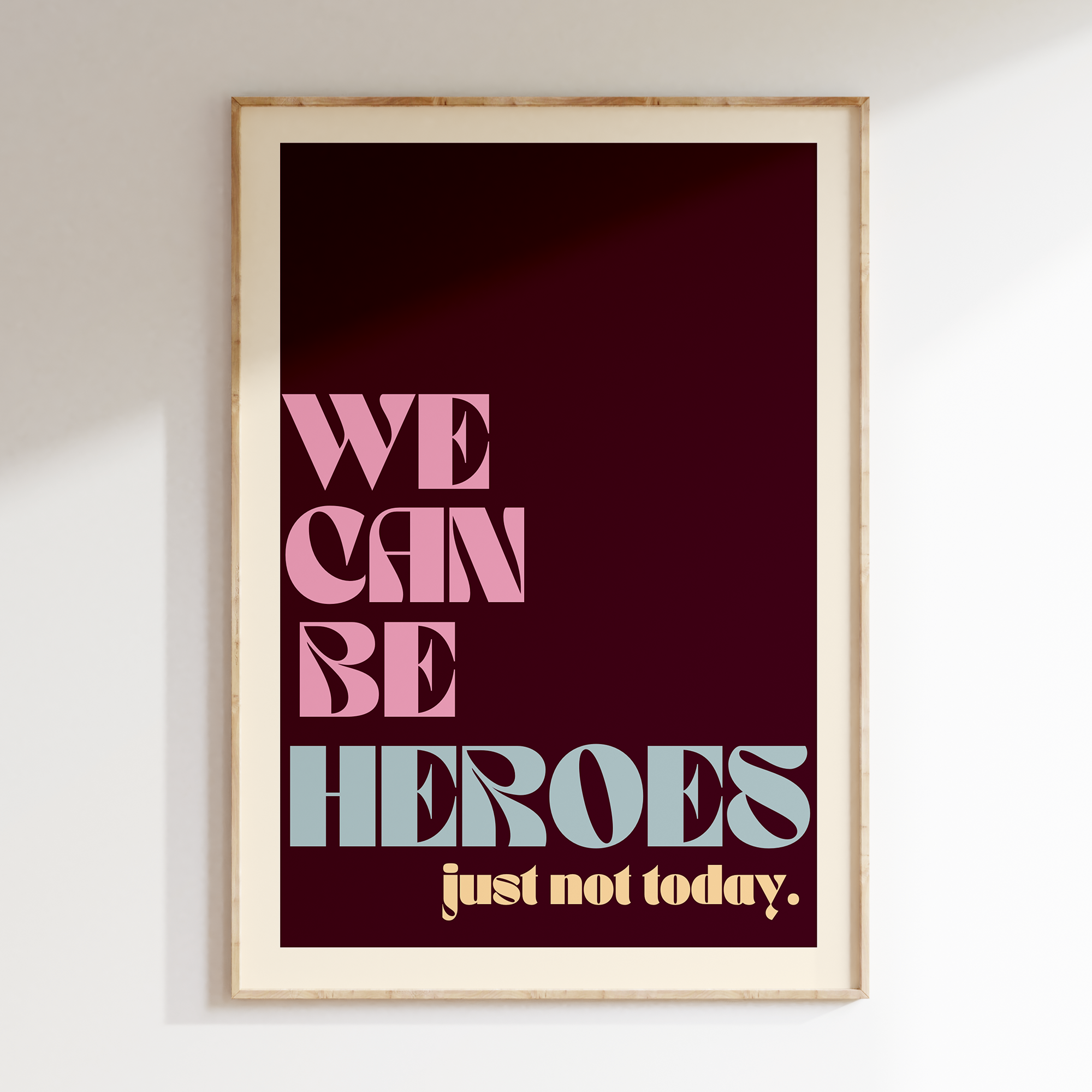 We Can Be Heroes retro print in oak frame, burgundy background with cream lettering and 'just not today' subline